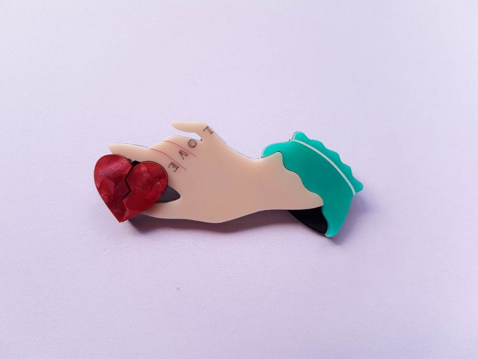 Fancy Hand Holding a Broken Heart Brooch